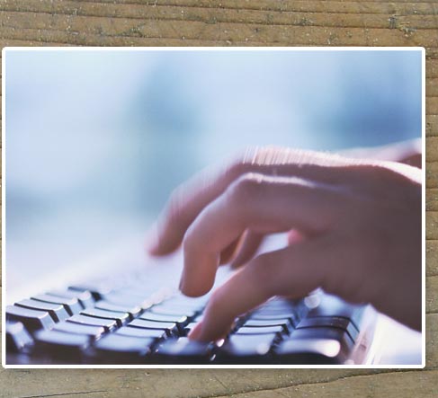 Hands on a keyboard.